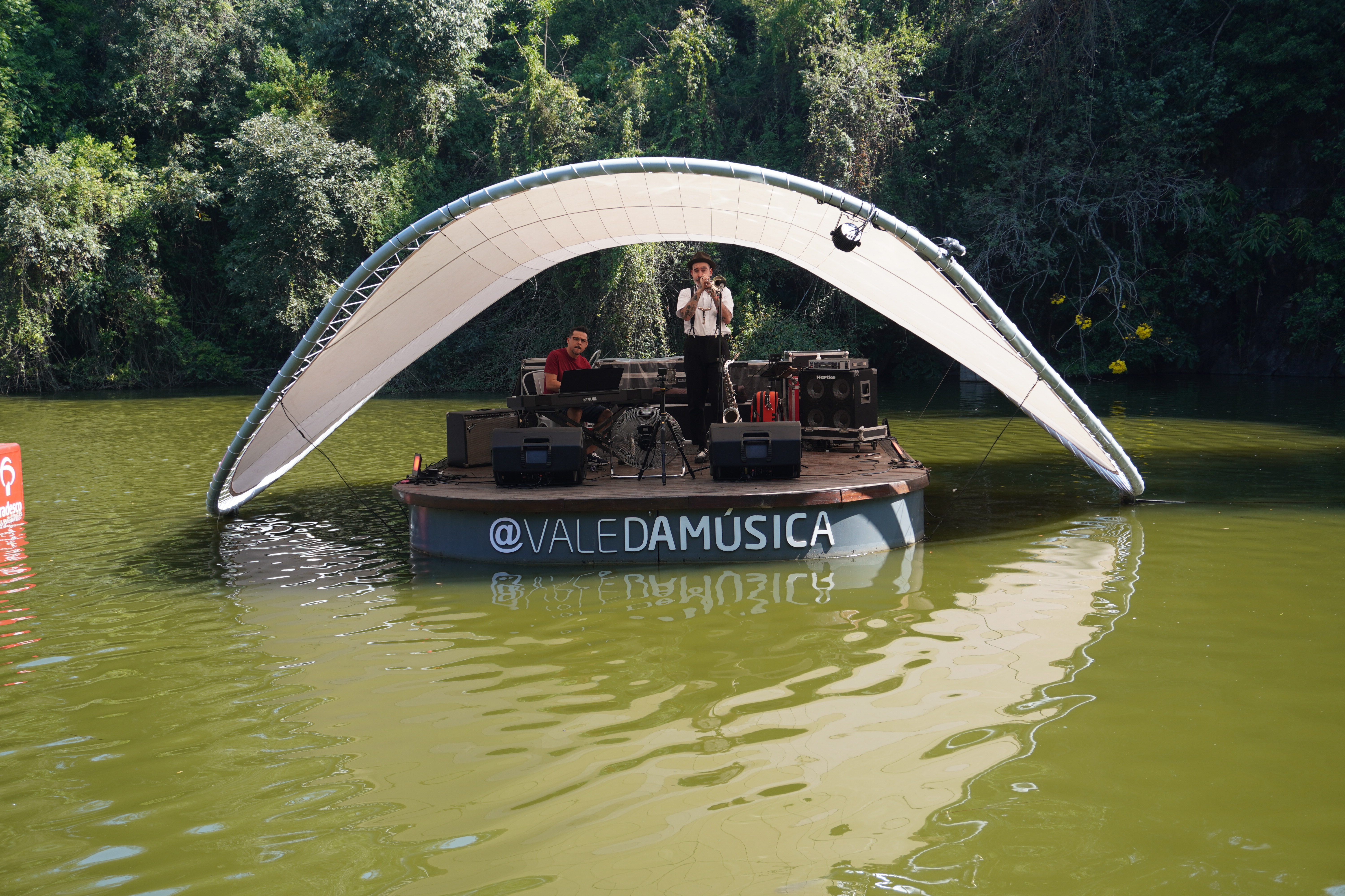 Jazz band playing music in a little stage located in the middle of the lake