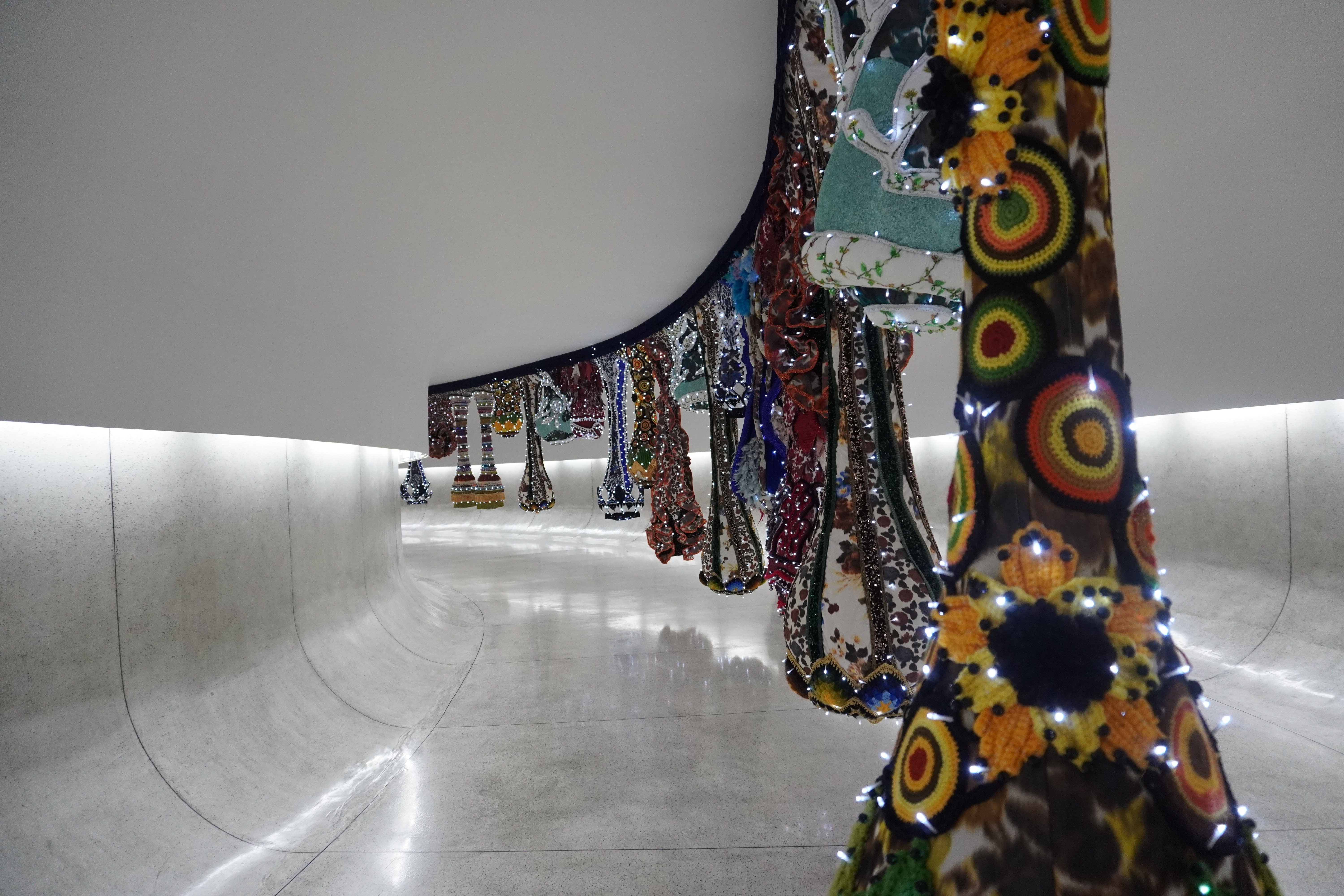 The underground tunnel decorated with a colorful modern art exhibit by Joana Vasconcelos