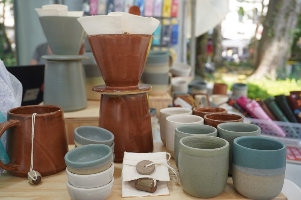 
Traditional Brazilian coffee brewer and a series of cups and mini bowls made in ceramics 