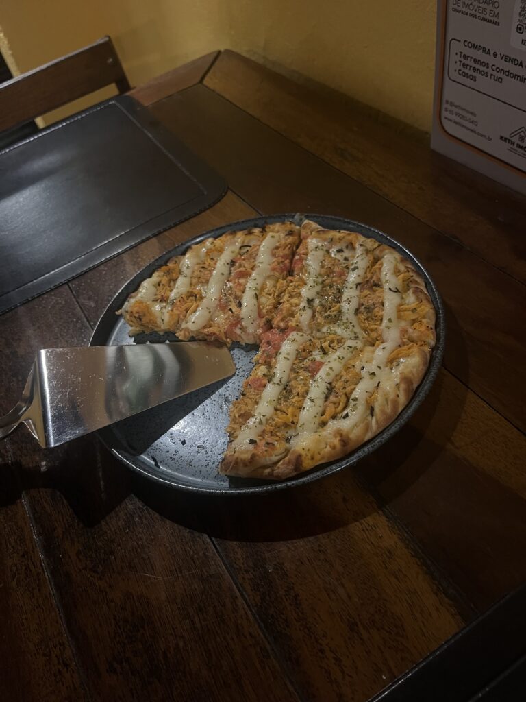 Chicken and requeijão (Brazilian cream cheese) mini pizza served at Margherita Pizza in downtown Chapada dos Guimarães.