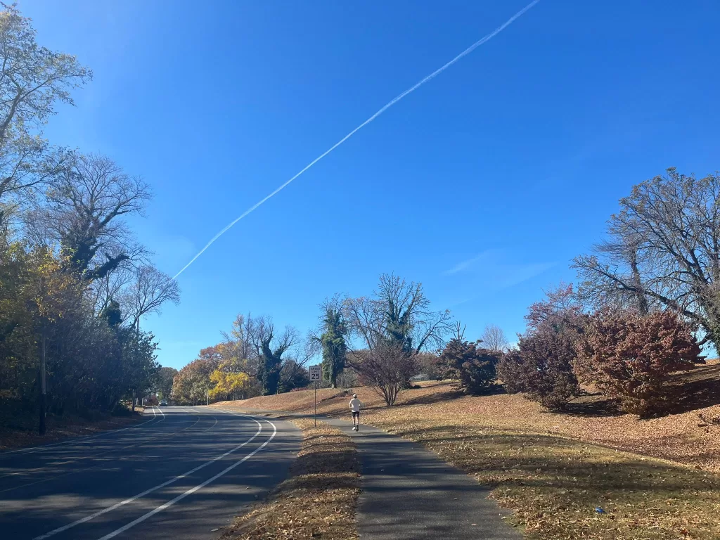 Man running at the Schuylkill River trail during the fall