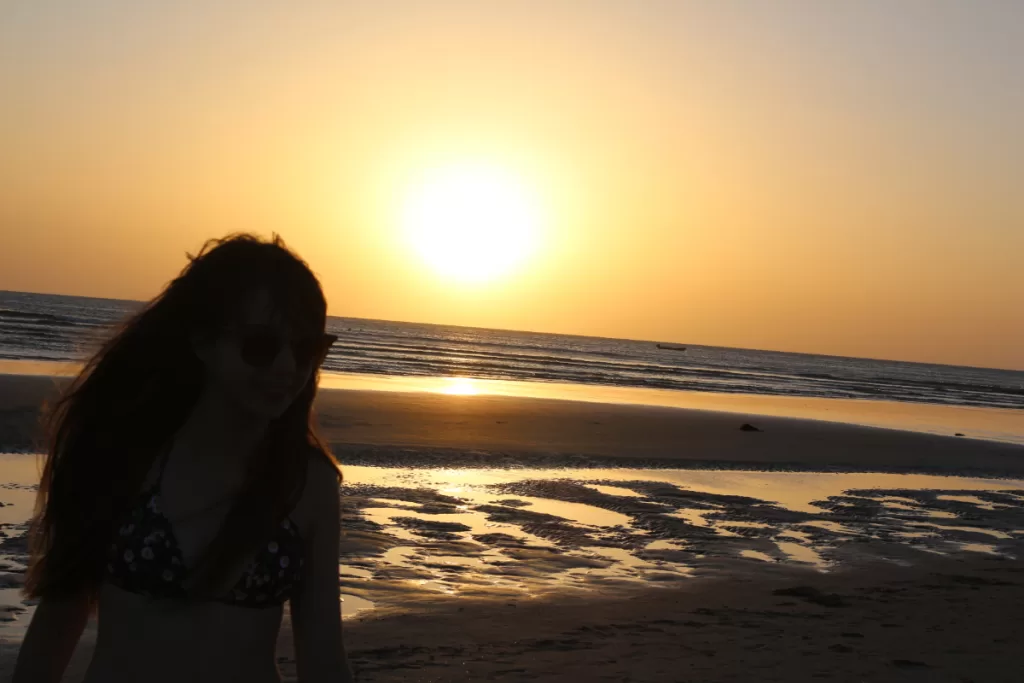 Brazilian girl enjoying sunset at Jericoacoara in Brazil