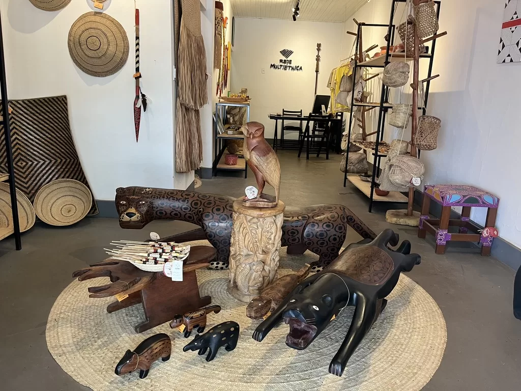 Inside of a store selling indigenous products. Most products are made out of straw or wood. 