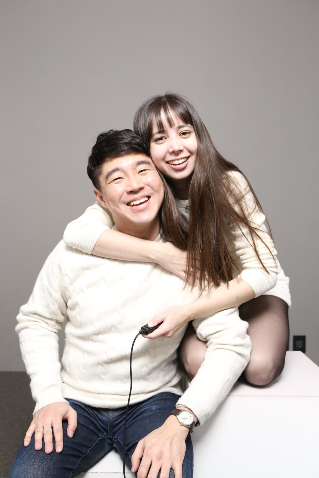 Korean man and white woman posing in a self-photo studio photoshoot in Seoul