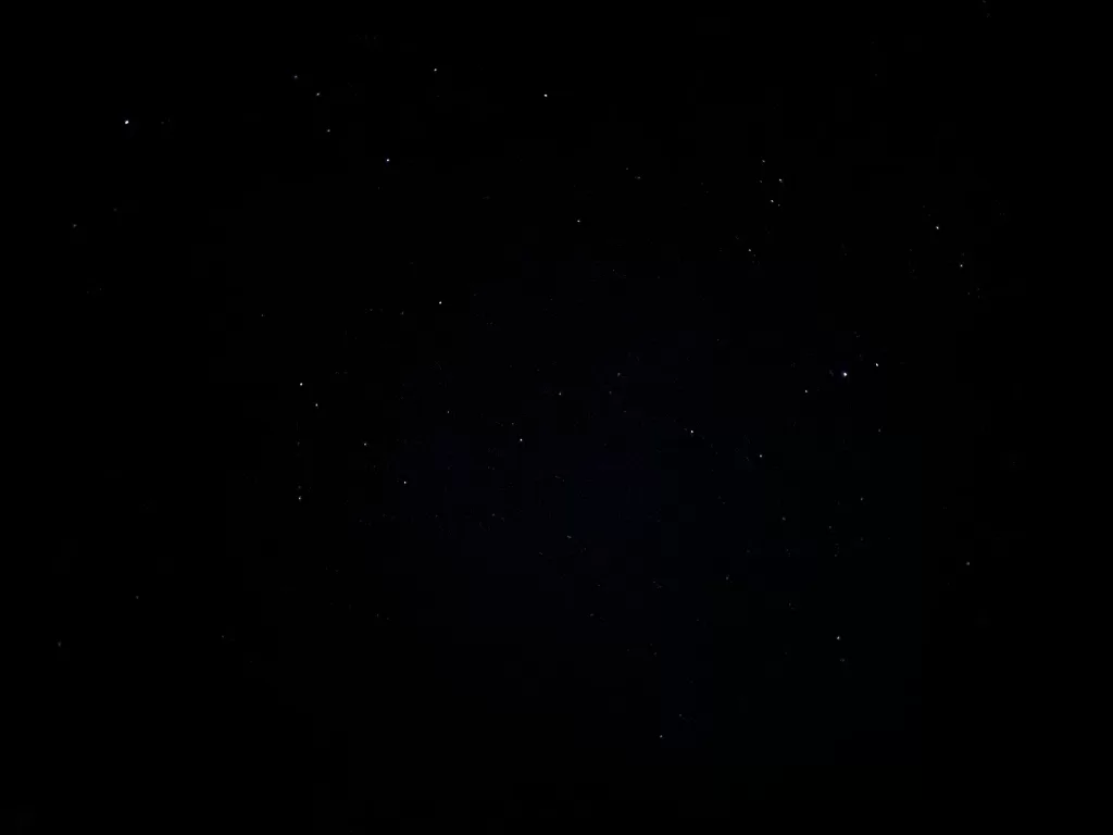 A few stars in a pitch-black sky