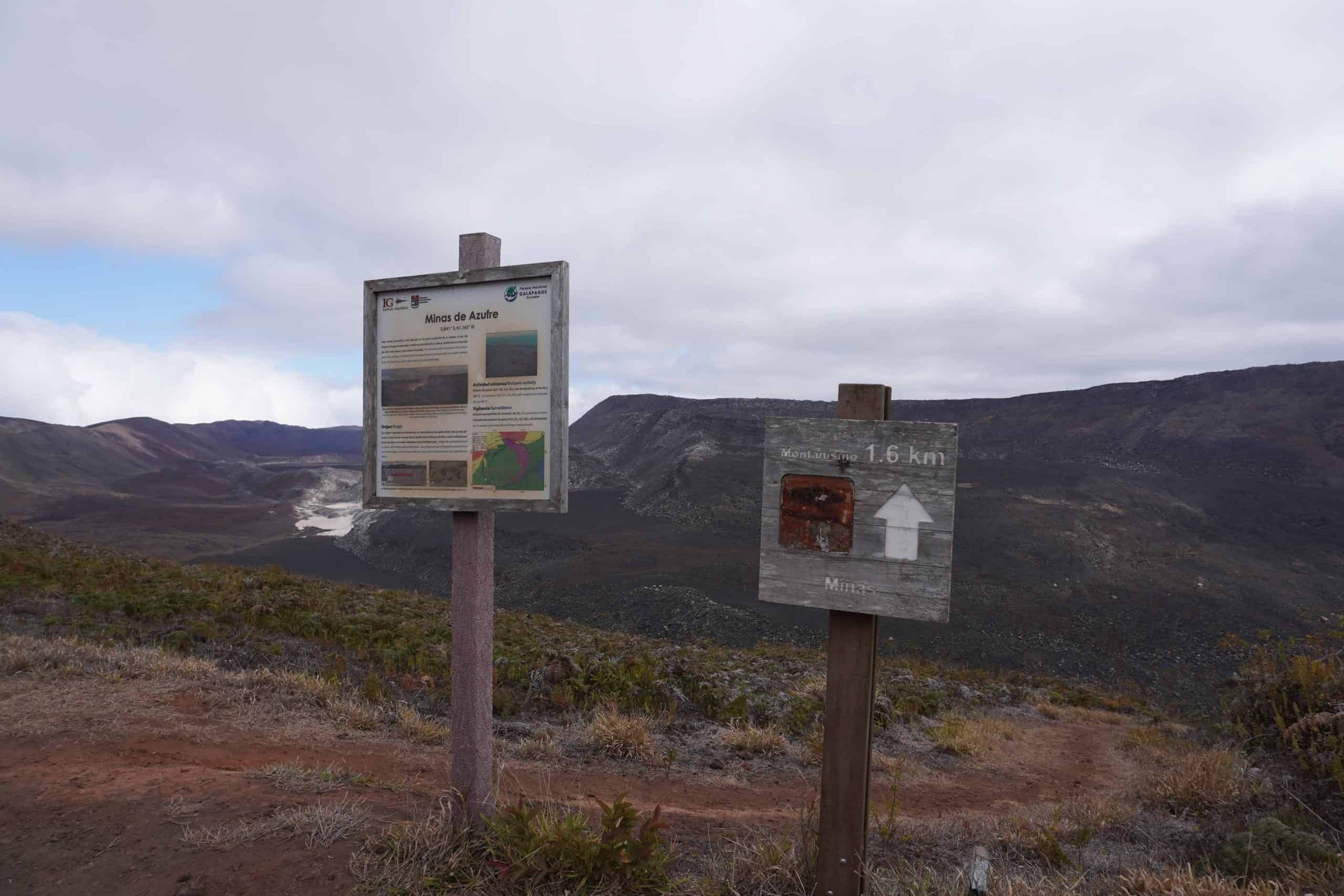 Signs marking the entrance of the Sierra Negra Sulfur Mines Hiking Trail