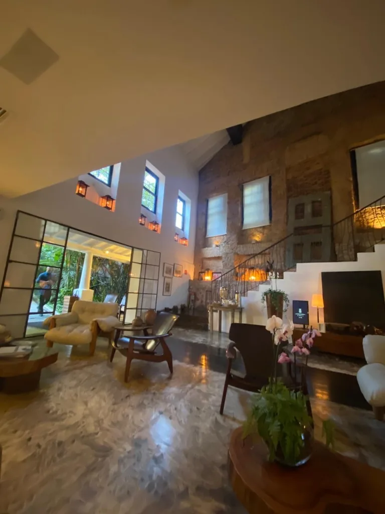 Lobby of the MGallery hotel in Santa Teresa, filled with a lot of high end wood furniture. MGallery is one of the best luxury hotels in Rio de Janeiro and the well furnished lobby shows it!