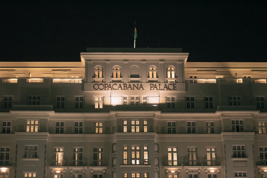 Stunning nighttime facade of the historic Copacabana Palace in Rio de Janeiro.